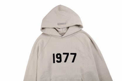 FEAR OF GOD ESSENTIALS "1977" HOODIE STONE GREY