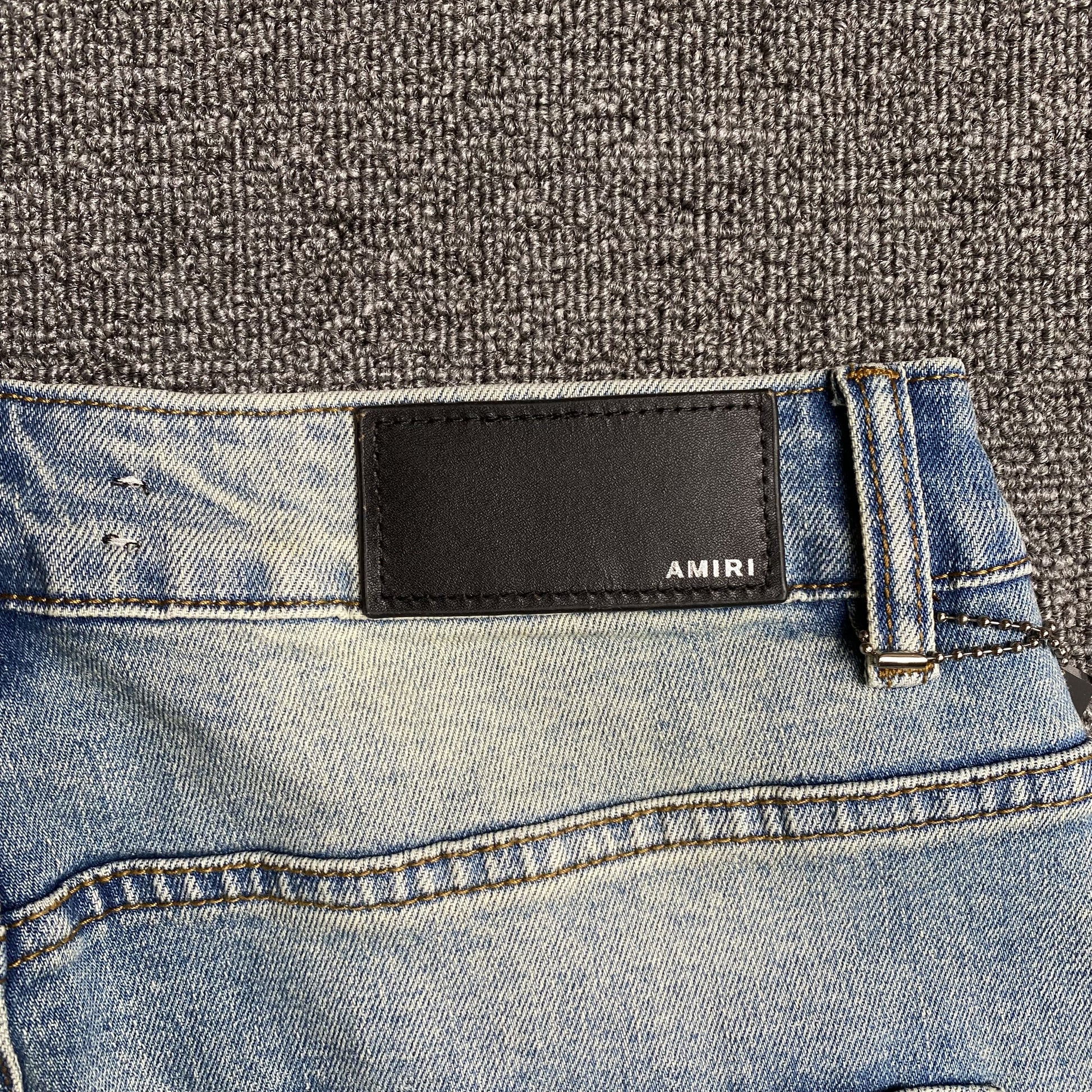 AMIRI VARSITY LOGO JEANS - Prime Reps
