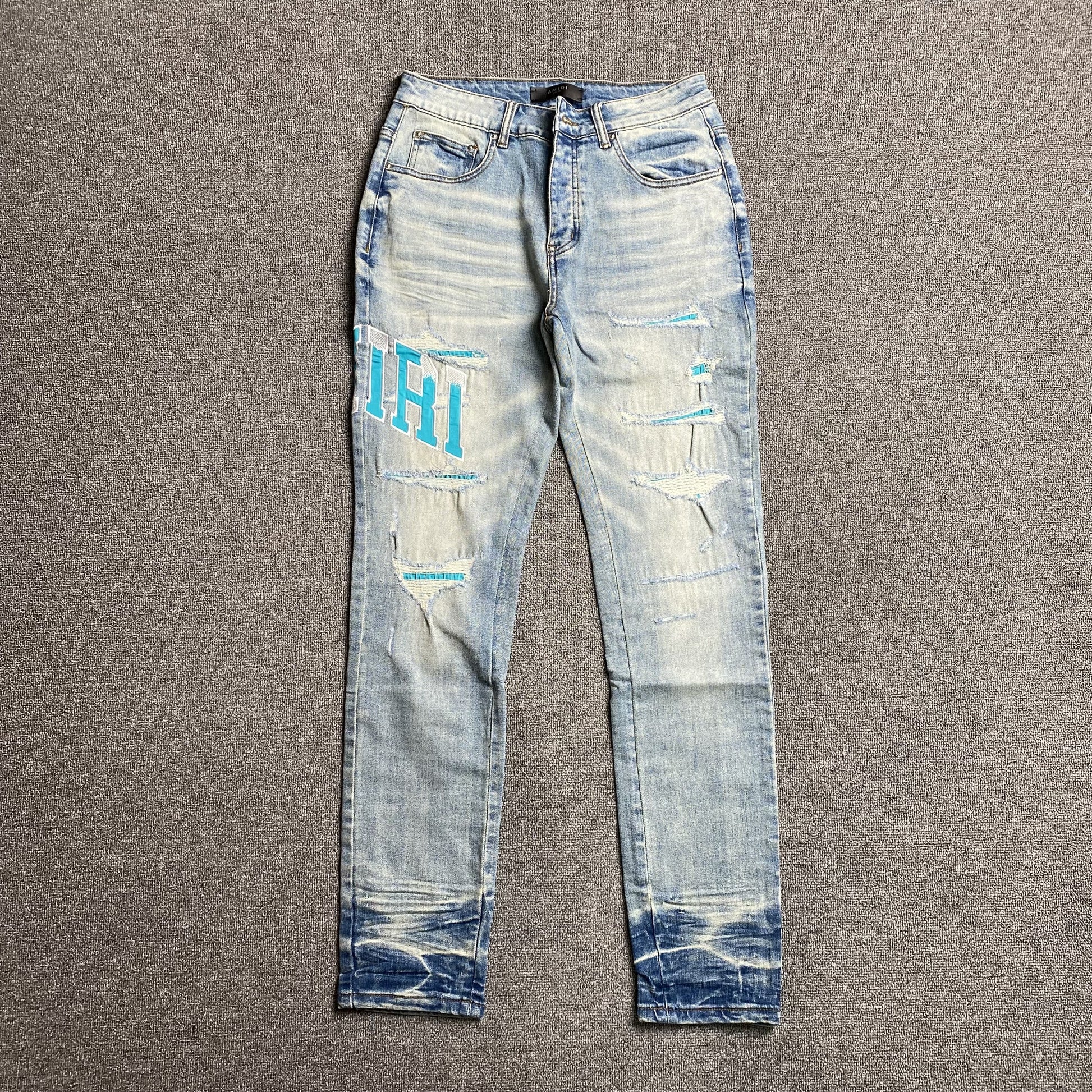 AMIRI VARSITY LOGO JEANS - Prime Reps