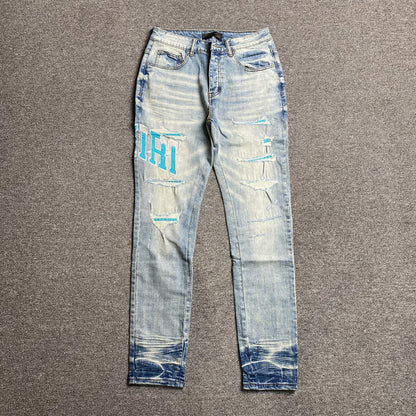 AMIRI VARSITY LOGO JEANS - Prime Reps
