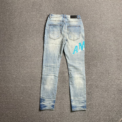 AMIRI VARSITY LOGO JEANS - Prime Reps