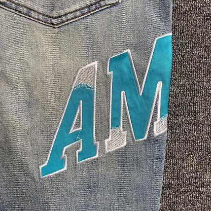 AMIRI VARSITY LOGO JEANS - Prime Reps