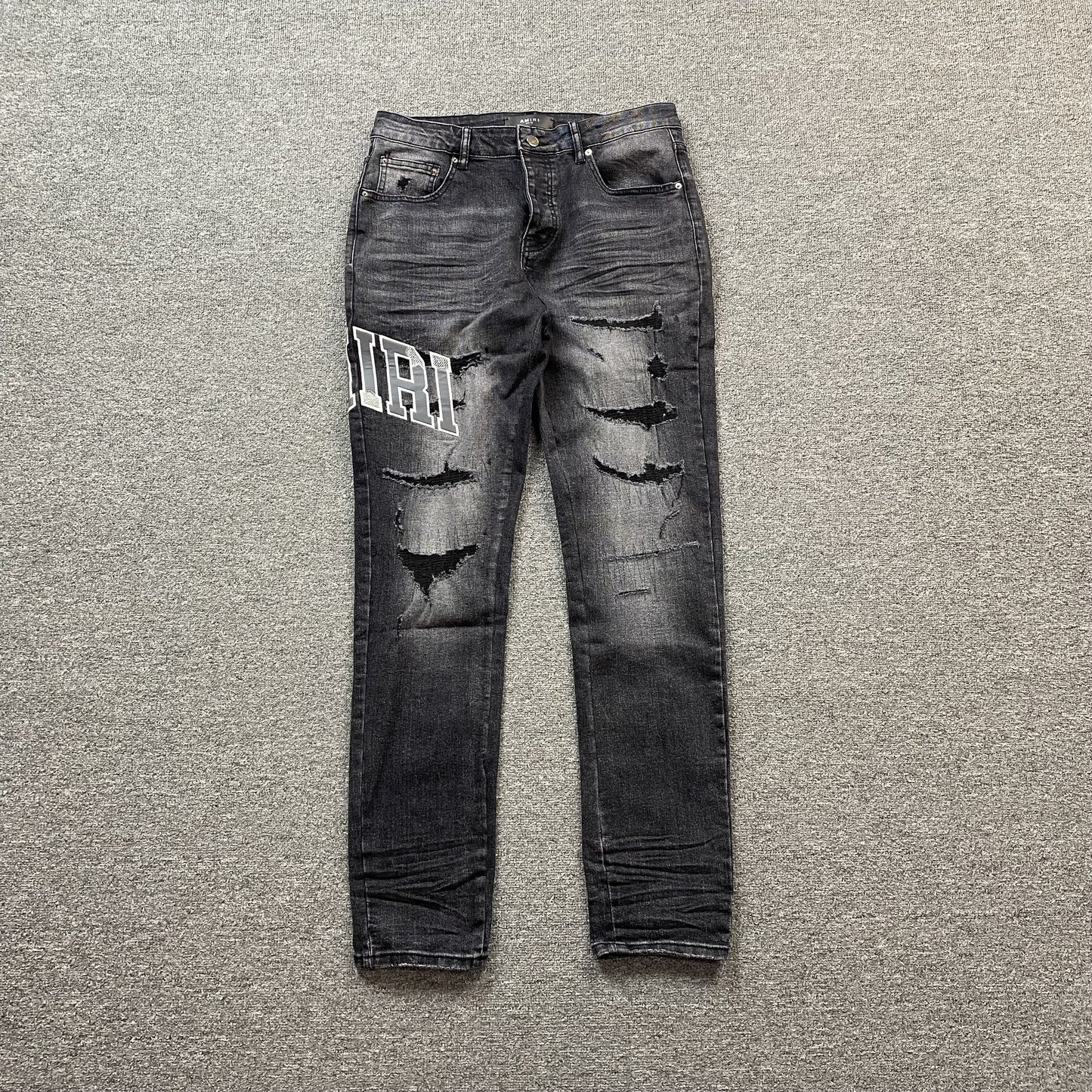 AMIRI VARSITY LOGO REPAIR JEANS - Prime Reps