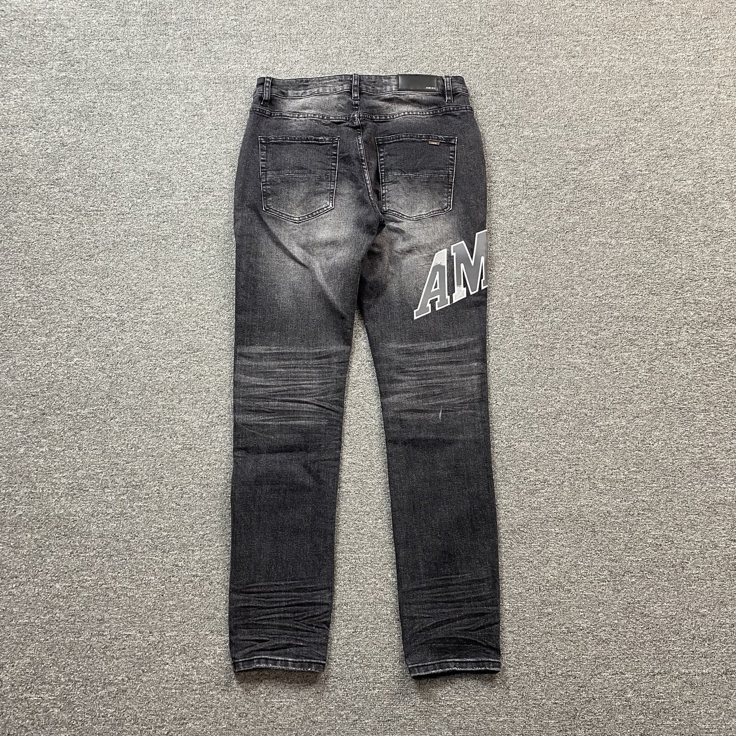 AMIRI VARSITY LOGO REPAIR JEANS - Prime Reps