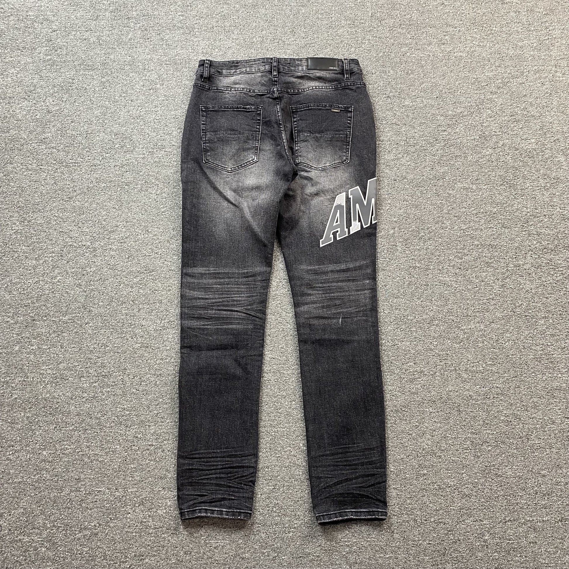 AMIRI VARSITY LOGO REPAIR JEANS - Prime Reps