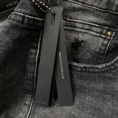 AMIRI VARSITY LOGO REPAIR JEANS - Prime Reps