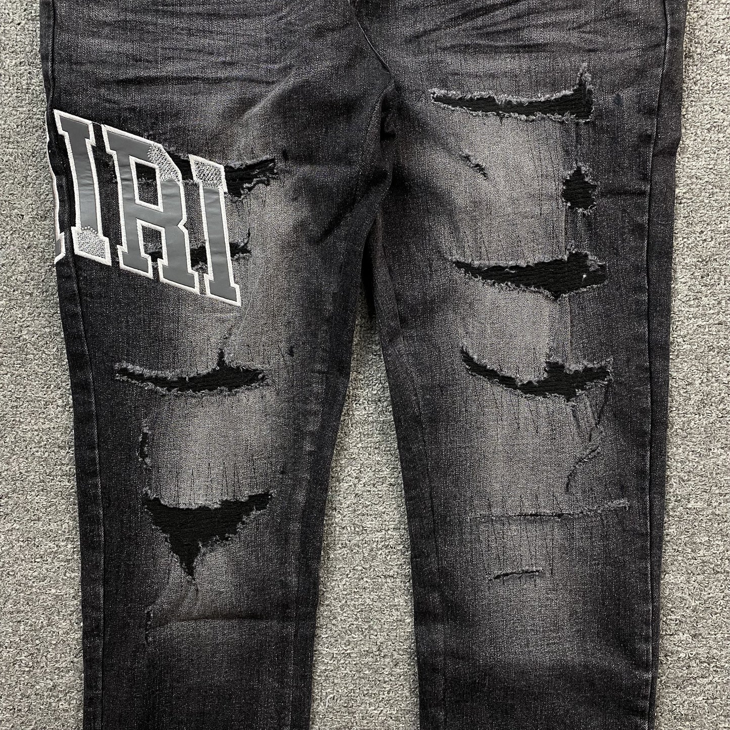 AMIRI VARSITY LOGO REPAIR JEANS - Prime Reps