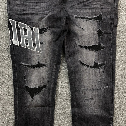 AMIRI VARSITY LOGO REPAIR JEANS - Prime Reps