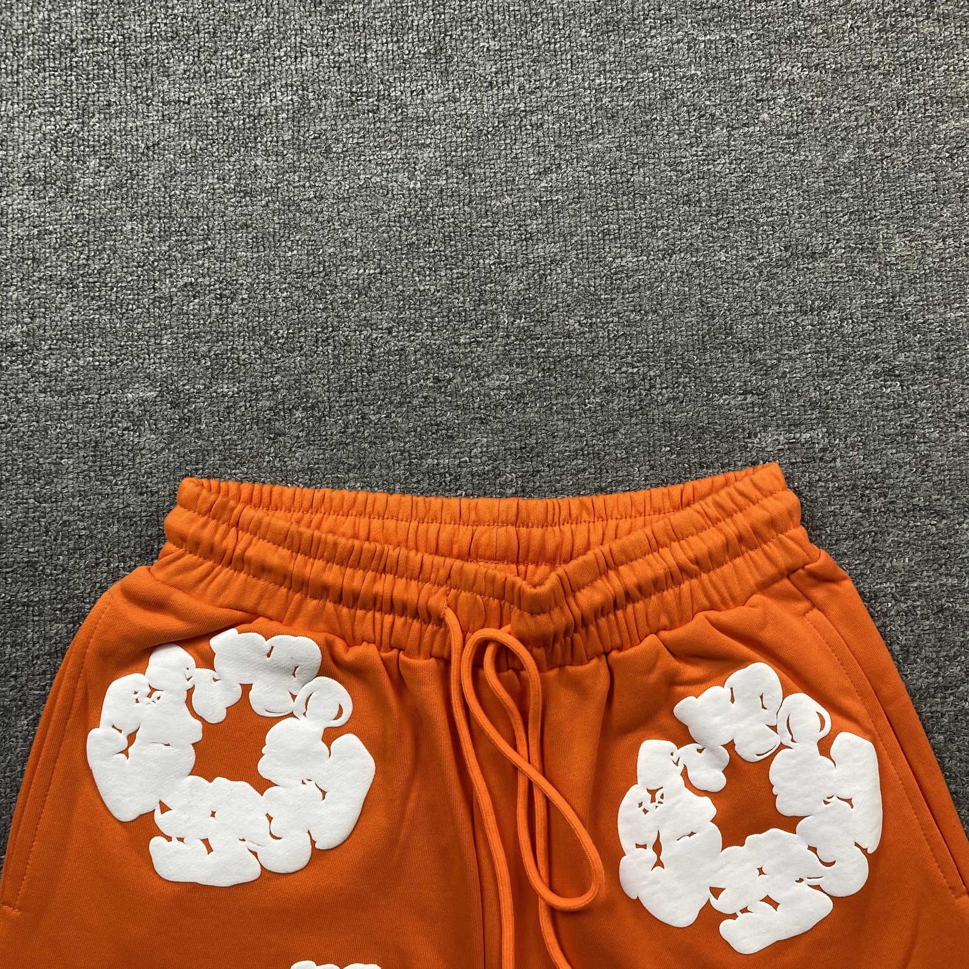 DENIM TEARS COTTON WREATH SHORTS ORANGE - Prime Reps