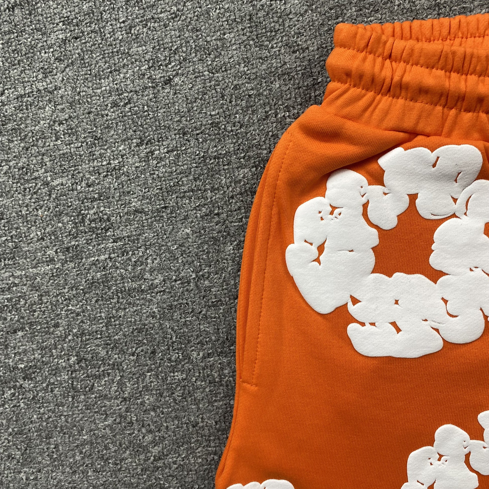 DENIM TEARS COTTON WREATH SHORTS ORANGE - Prime Reps